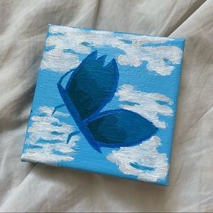 handmade butterfly in the cloudy sky painting